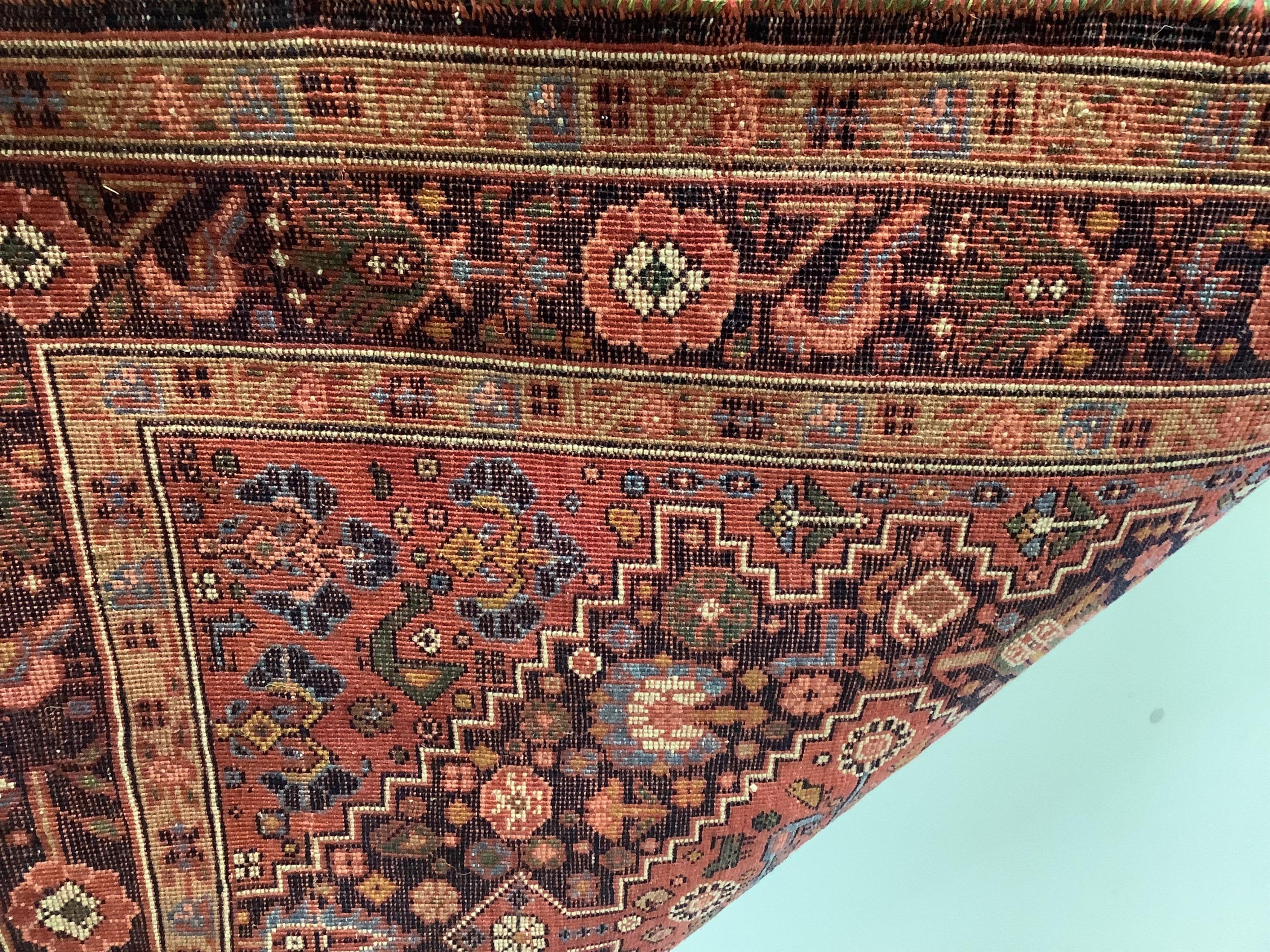 A Caucasian red ground runner, woven a central row of lozenges, 222 x 90cm. Condition - good